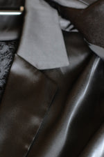 Load image into Gallery viewer, Midnight Noir Opulence – Black Satin Suit with Low-Cut Shirt & Lace Trousers