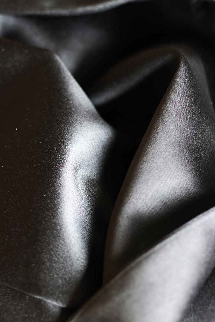 Midnight Noir Opulence – Black Satin Suit with Low-Cut Shirt & Lace Trousers